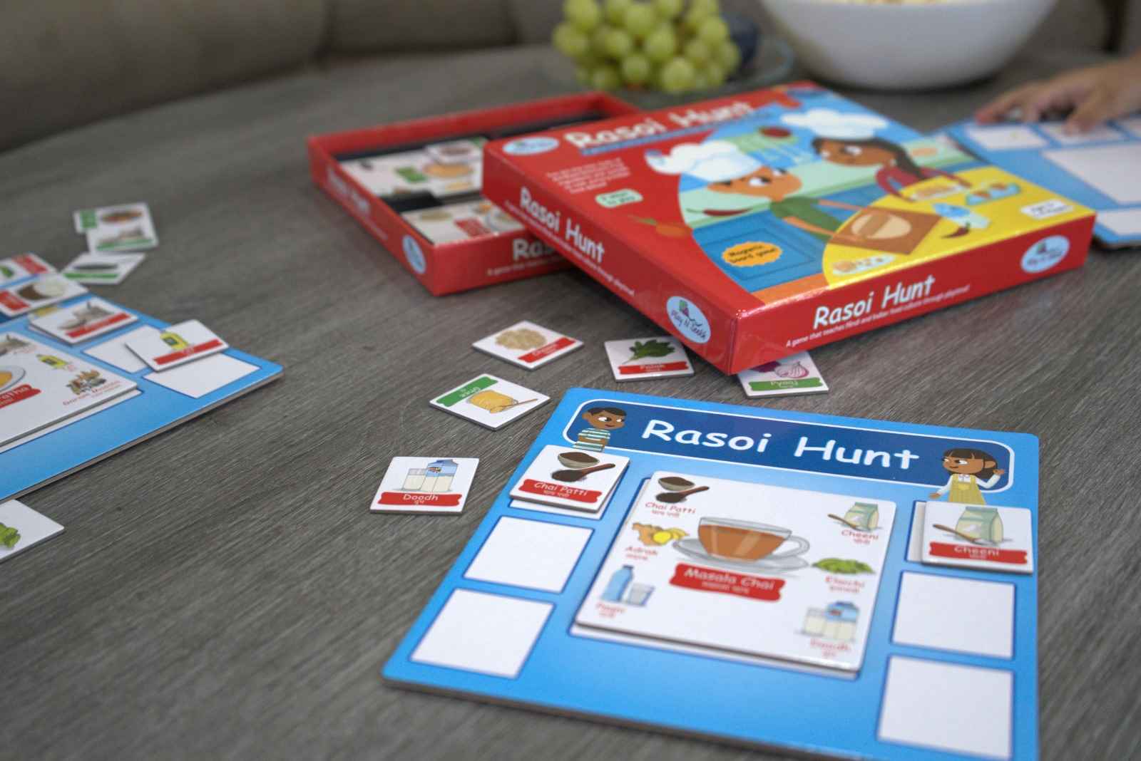 Rasoi Hunt magnetic board game to teach Hindi words around Indian food dishes. Game made by PlayNSeekh.