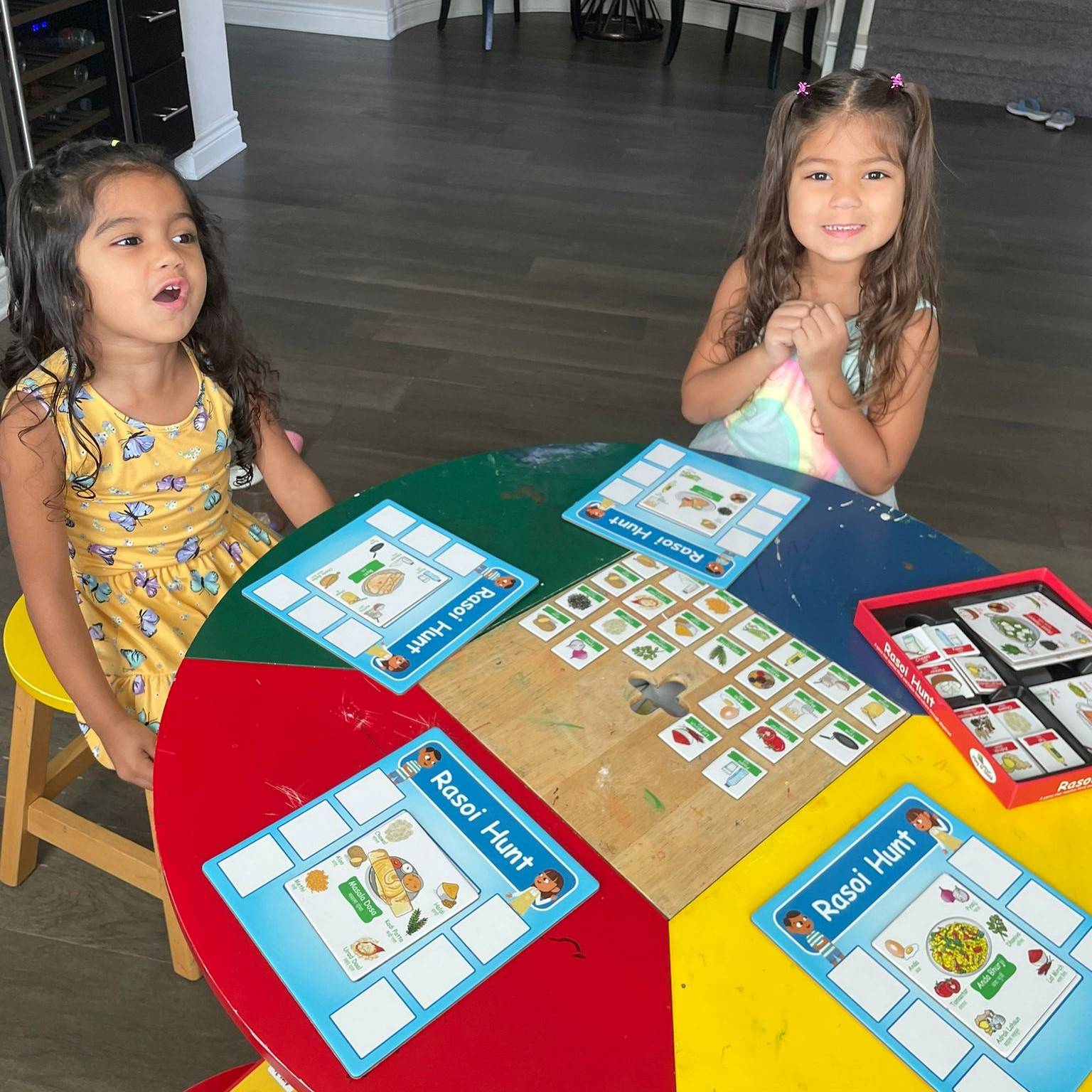 Kids having fun playing Rasoi Hunt game created by PlayNSeekh. During play, kids are matching the Indian food ingredients and dishes. The kids learn to speak Hindi by reading out loud the labels of the food ingredients and dishes. 